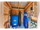 Interior view of the home's updated water filtration and conditioning system in a wooden shed at 12408 Wexford Hills Rd, Riverview, FL 33569