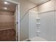 Bathroom featuring a walk-in closet and shower and tub combination at 13034 Wellspring Dr, Lithia, FL 33547