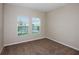 Bedroom featuring carpet, neutral walls, two windows with blinds and electric outlets at 13034 Wellspring Dr, Lithia, FL 33547