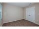 This bedroom features neutral walls, carpet, and a double door closet at 13034 Wellspring Dr, Lithia, FL 33547