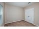 Bedroom featuring a large closet, carpet and neutral walls with a window at 13034 Wellspring Dr, Lithia, FL 33547