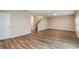 Open concept living area featuring wood flooring and a stairway to the upper level at 13034 Wellspring Dr, Lithia, FL 33547