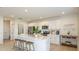 Bright kitchen featuring white cabinets, stainless steel appliances, and a spacious island at 13470 Tropical Breeze Way, Hudson, FL 34669