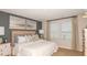 Cozy primary bedroom with neutral decor, ample natural light, and plush bedding at 13470 Tropical Breeze Way, Hudson, FL 34669