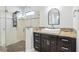 Beautiful bathroom with a modern vessel sink, dark cabinets, granite counters, and glass enclosed shower at 14227 Alistar Manor Dr, Wimauma, FL 33598