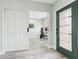 Bright foyer with wood floors, barn door to office, and decorative glass front door at 14227 Alistar Manor Dr, Wimauma, FL 33598