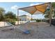 Community playground with swings, seesaw, and shaded play area for outdoor enjoyment at 14227 Alistar Manor Dr, Wimauma, FL 33598