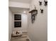 Charming entryway for pets features wood-look flooring, dog-themed decor, and convenient storage hooks at 14423 Meadow Bird Ave, Riverview, FL 33579