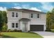 Charming two-story home with a two-car garage, neatly manicured lawn, and pleasing architectural details at 14423 Meadow Bird Ave, Riverview, FL 33579