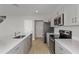 Well-equipped kitchen with modern appliances, stone countertops, and ample storage space at 14789 Summer Branch Dr, Lithia, FL 33547