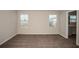 Bright bedroom with plush carpeting, neutral walls, and two large windows that let in natural light at 14811 Summer Branch Dr, Lithia, FL 33547