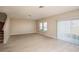 Spacious living room featuring neutral walls, wood-look flooring, and large windows for natural light at 14811 Summer Branch Dr, Lithia, FL 33547