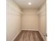 Spacious walk-in closet featuring carpet and white shelving for optimal organization at 14811 Summer Branch Dr, Lithia, FL 33547