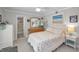 Cozy bedroom with soft lighting, a comfortable bed, and en-suite bathroom at 1600 Gulf Blvd # 212, Clearwater Beach, FL 33767