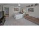 Comfortable bedroom featuring soft carpet, a ceiling fan, and tasteful decor for a relaxing retreat at 1600 Gulf Blvd # 212, Clearwater Beach, FL 33767