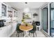 Charming breakfast nook with built-in cabinets, modern lighting, and access to the terrace at 1600 Gulf Blvd # 212, Clearwater Beach, FL 33767