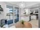 Modern kitchen adjoins dinette and has access to a large balcony via glass sliding doors at 1600 Gulf Blvd # 212, Clearwater Beach, FL 33767