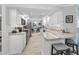 Bright kitchen features white cabinets, granite countertops, stainless steel appliances, and breakfast bar at 1600 Gulf Blvd # 212, Clearwater Beach, FL 33767