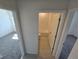 Cozy hallway view to bathroom and bedroom entrances showcasing the home's layout at 209 Lazy Shore Dr, Nokomis, FL 34275