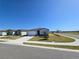 Inviting one-story home showcasing a beautifully landscaped front yard on a corner lot at 209 Lazy Shore Dr, Nokomis, FL 34275