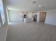 Spacious living room and kitchen features tiled floors and abundant natural light at 209 Lazy Shore Dr, Nokomis, FL 34275