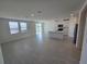 Bright, open living room and kitchen with tile flooring and stainless steel appliances at 209 Lazy Shore Dr, Nokomis, FL 34275