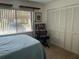 Comfortable bedroom with ample natural light, closet and neutral carpet at 2513 Oakleaf Ln # 26C, Clearwater, FL 33763