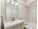 Bathroom featuring a sleek vanity, a neutral color palette, and a built-in bathtub at 2650 Countryside Blvd # B-110, Clearwater, FL 33761