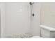 Modern bathroom showcasing tiled shower with a handheld shower head and mosaic floor at 2650 Countryside Blvd # B-110, Clearwater, FL 33761