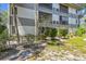 A charming condo featuring well-kept landscaping and a pleasant outdoor space at 2650 Countryside Blvd # B-110, Clearwater, FL 33761