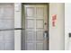 Unit #110 featuring a well-maintained entryway with a secure door and visible alarm system at 2650 Countryside Blvd # B-110, Clearwater, FL 33761