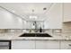 Granite countertops and modern faucet add a touch of elegance to this bright kitchen area at 2650 Countryside Blvd # B-110, Clearwater, FL 33761