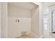 Laundry room with in-wall hookups and tile flooring at 2650 Countryside Blvd # B-110, Clearwater, FL 33761