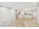 Open-concept living area featuring tile floors, recessed lighting and modern finishes and an eat in kitchen at 2650 Countryside Blvd # B-110, Clearwater, FL 33761