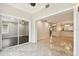 A seamless transition from living area to kitchen with light-colored tile floors and open concept at 2650 Countryside Blvd # B-110, Clearwater, FL 33761