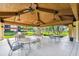 Community pavilion with outdoor seating overlooking a tranquil pond at 2650 Countryside Blvd # B-110, Clearwater, FL 33761