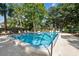 Community swimming pool featuring lots of seating areas to relax and enjoy at 2650 Countryside Blvd # B-110, Clearwater, FL 33761