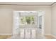 A light-filled sun room with tile flooring, a ceiling fan, and large windows for enjoying the view at 2650 Countryside Blvd # B-110, Clearwater, FL 33761