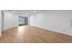 Bright living room with wood floors and sliding glass doors at 27153 Capri Shores Cir, Englewood, FL 34223