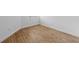 Compact room with wood-look tile flooring, ideal for a small office or storage space at 27153 Capri Shores Cir, Englewood, FL 34223