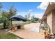 Spacious backyard features patio with a fire pit and mature landscaping for a tranquil outdoor experience at 2906 Beagle Pl, Seffner, FL 33584
