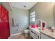 Bright bathroom with granite counters, vanity, tile floor, and a shower/tub combo at 2906 Beagle Pl, Seffner, FL 33584