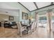 Dining room with a table, chairs, view to the living room and sliding glass doors to the backyard at 2906 Beagle Pl, Seffner, FL 33584