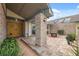 Inviting entrance with double doors leading to a charming outdoor brick patio with comfortable seating and plants at 2906 Beagle Pl, Seffner, FL 33584