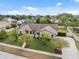 An aerial of a well-kept home with manicured lawn, mature landscaping, and inviting walkway at 2906 Beagle Pl, Seffner, FL 33584