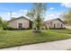 Charming single-story home featuring a brick facade, well-manicured lawn, and mature tree in the front yard at 2906 Beagle Pl, Seffner, FL 33584