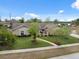 Aerial view showcasing a well-maintained home with mature trees and an inviting walkway at 2906 Beagle Pl, Seffner, FL 33584
