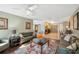 Inviting living room with hardwood floors, comfortable sofas, and abundant natural light flowing through the windows at 2906 Beagle Pl, Seffner, FL 33584