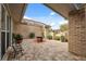 Charming outdoor patio area featuring brick pavers, comfortable seating, and lush greenery for a relaxing ambiance at 2906 Beagle Pl, Seffner, FL 33584