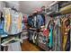 Walk-in closet with custom shelving, hanging rods, and built-in drawers provides organization at 2906 Beagle Pl, Seffner, FL 33584
